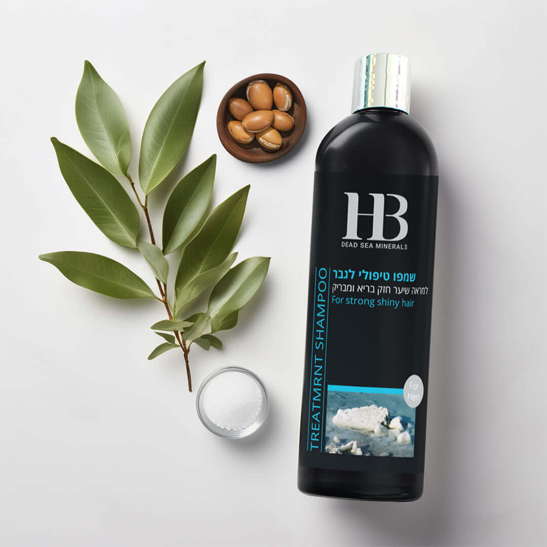 HB treatment shampoo bottle with green leaves and almonds on a light gray background
